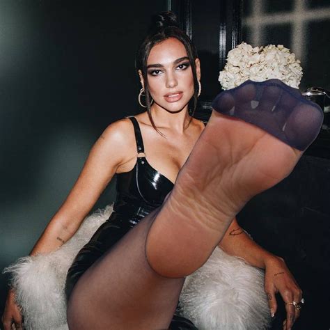 Dua Lipa showing off her nyloned foot by TheFakerInTheRye on DeviantArt