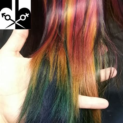 This peek-a-boo rainbow hair was done by salon owner/stylist ...