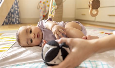 Rolling: When do babies roll over and signs to look for | Lovevery