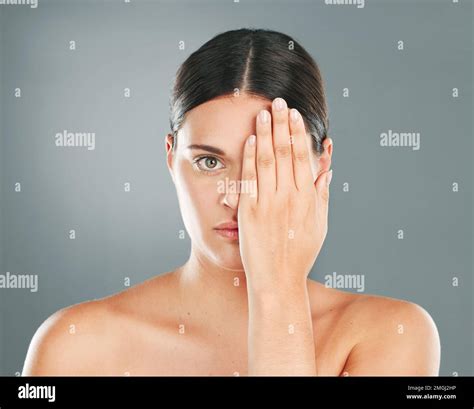 Face, cover and portrait of a woman with a hand on eye isolated on a ...