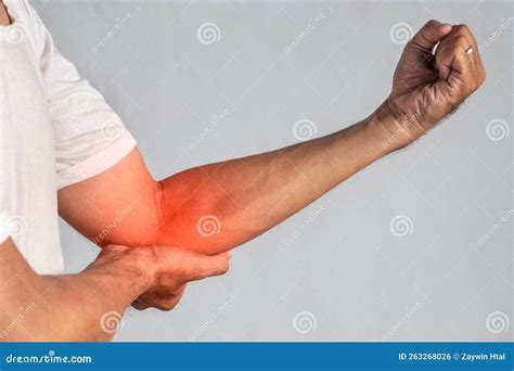 Pain in the Elbow Joint of Asian Young Man. Concept of Elbow Pain, Injury, Rheumatism or ...