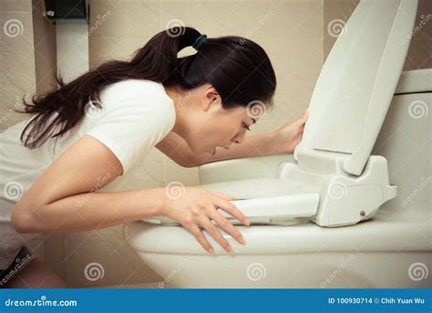 Closeup of Young Pretty Woman Vomiting into Toilet Stock Photo - Image ...