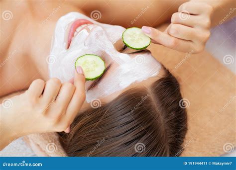 Cucumber Over the Eyes and a White Clay Mask for Facial Skin Care Stock ...