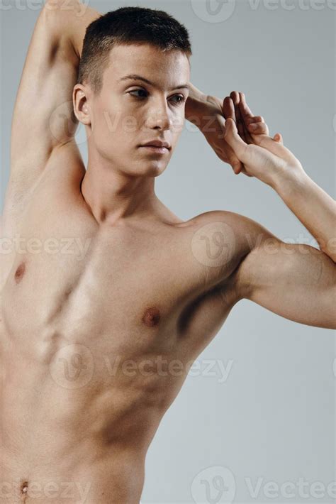 athletic physique young male nude torso gray background portrait ...