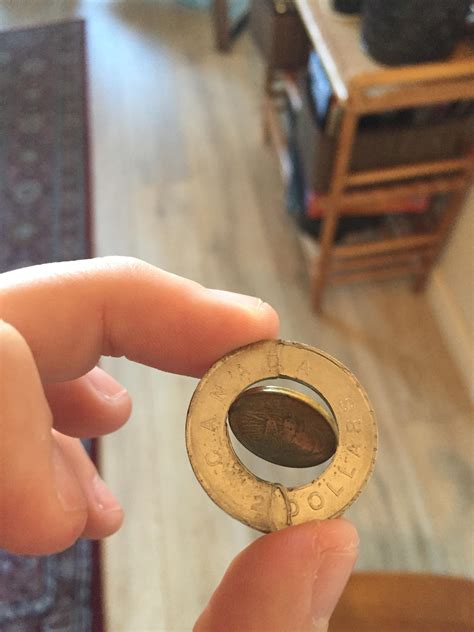 This Toonie (Canadian two dollar coin) with the middle coin separated ...