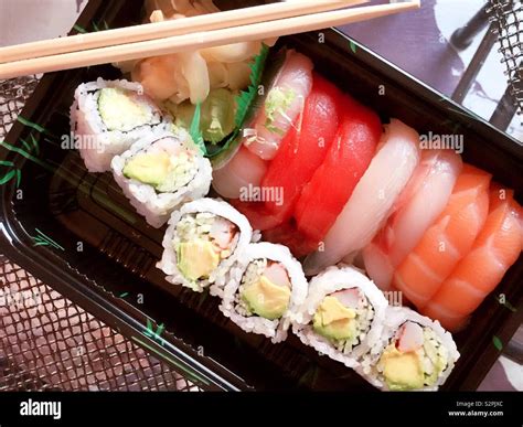 A Japanese delivery meal of sushi pieces and California roll, New York ...