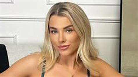 Glamorous footballer Madelene Wright sends fans wild by stripping to racy green lingerie in ...