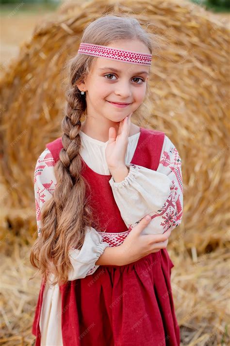 Premium Photo | A blonde girl with big brown eyes in a slavic costume ...