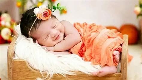 Smiling Cute Baby Girl Child Is Sleeping On Little Bed Wearing Light ...