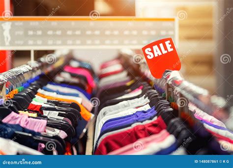 Retail Clothes Store Clearance. Garment Shop with Various Bright Youth ...