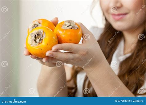 Woman Holds Persimmon Kaki Fruits Stock Photo - Image of weight ...