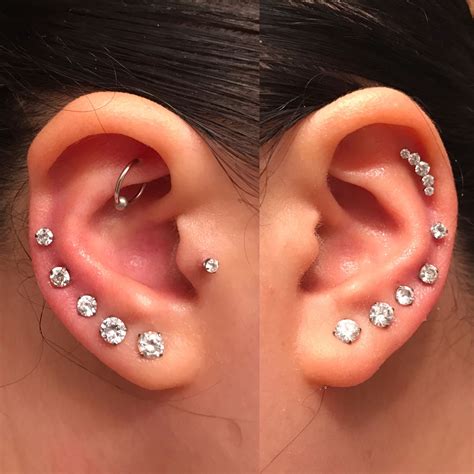 I love my ear piercings. -Rook -Tragus -Graduate Lobe -Mid helix -Upper ...