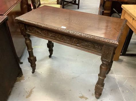 Lot 887 - Edwardian oak rectangular card table with
