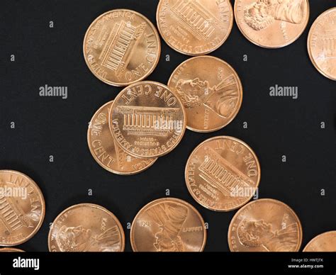 One Cent Dollar coins money (USD), currency of United States over black ...