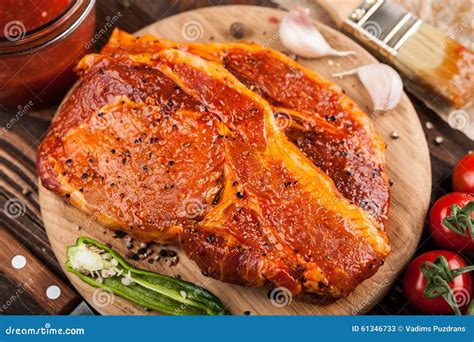 Marinated Pork Steaks on Cutting Board Stock Image - Image of chop ...
