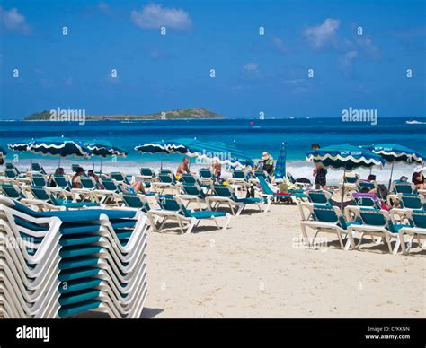 Sun bathers on beach chairs on Orient Bay or Orient Beach St. Martin or ...