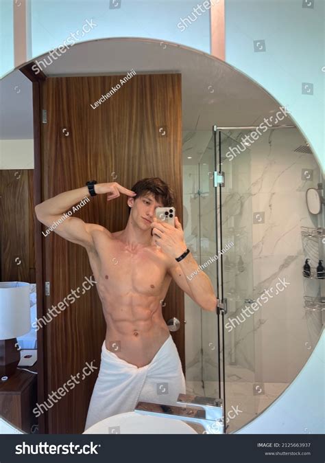 Стоковая фотография 2125663937: Cute Handsome Guy Takes Selfie Mirror ...