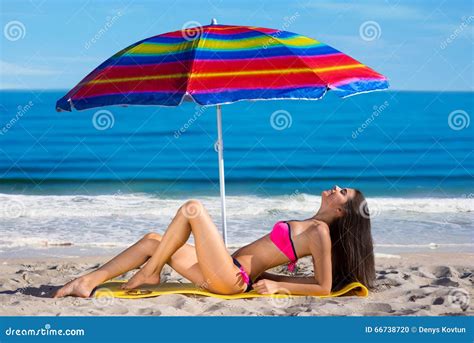 Model Sunning on the Beach. Stock Photo - Image of romantic, laugh ...