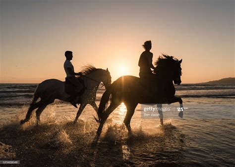 Stock Photo : People horse riding along the beach. Tarifa, Cadiz, Costa ...