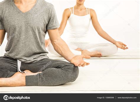 Couple sitting in lotus position — Stock Photo © OlgaZakrevskaya #135665598