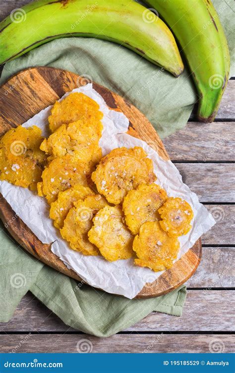 Fried Tostones, Green Plantains, Bananas with Guacamole Sauce Stock ...