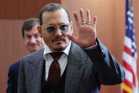 Johnny Depp laughs as court talks about his exposed penis