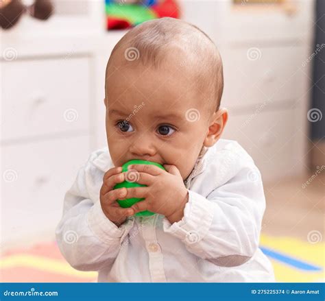 Adorable Caucasian Boy Sucking Ball Sitting on Floor at Kindergarten ...