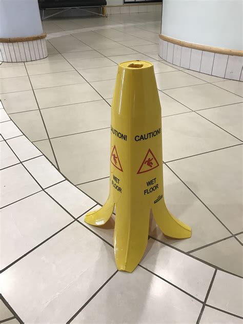 This wet floor sign is shaped like a banana peel : r/mildlyinteresting