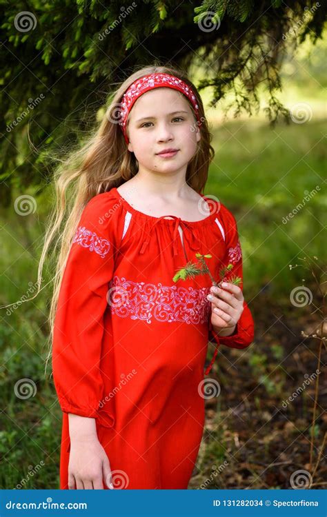 Cute Blond Young Girl Posing in a Russian Traditional Red Dress Near ...