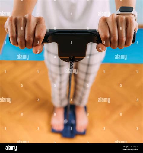 Woman using body composition scales Stock Photo - Alamy
