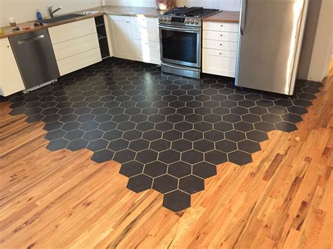 Our kitchen floor... ceramic tile and 3/4 red oak. I've never done ...