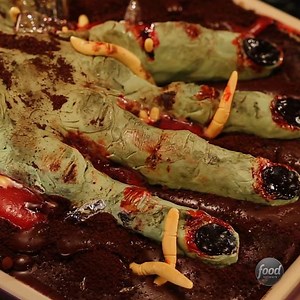 Nothing scarier than a maggot-infested zombie hand coming out of your cheesecake... Tune in for more Halloween Baking Championship at 9|8c! | Food Network