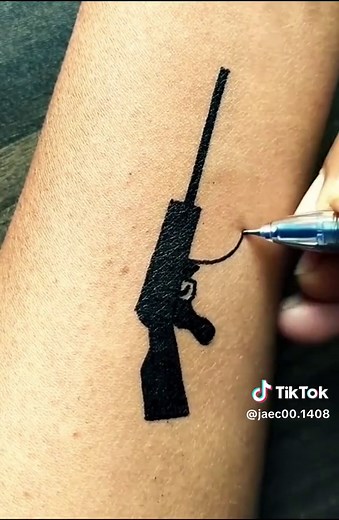 Intricate Rifle Tattoo Process on Forearm