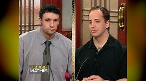 The plaintiff says he and the defendant became friends because they’re both Italian. He says that after the defendant got chest implants, they got infected, and he asked for a loan to get them repaired. The plaintiff has yet to be repaid and is suing. The defendant says the plaintiff hates him for being gay and often refers to him with slurs. He refuses to repay the plaintiff because he says he’s been threatened with bodily harm. | Judge Greg Mathis