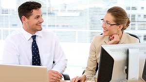 clip-5648570-focused-business-team-speaking-together-desk-office