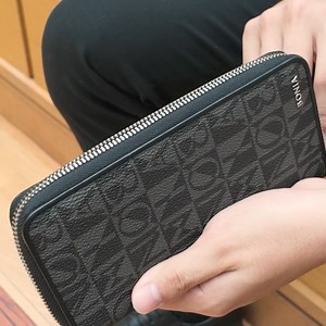 Who needs bags when you have the Corinne Monogram Long Zipper Wallet? With its unmatched functionality 16 card sleeves, a zip compartment, and a dedicated space for notes it's all you need to brave the day. #bonia #boniasingapore | BONIA