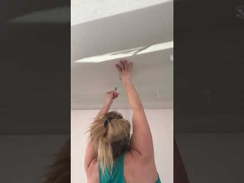 Installing a Plant Hook in the Ceiling With a Drill