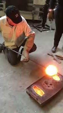 Glass casting: pouring hot glass into various sand molds