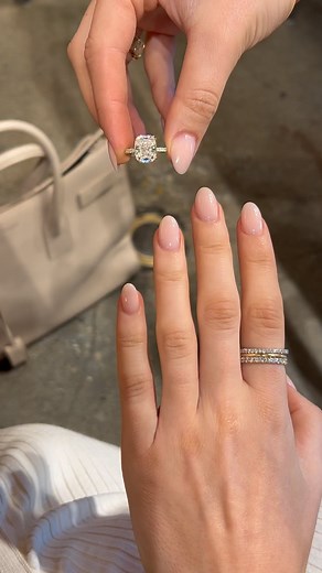 EAST WEST GEM CO. // on Instagram: "This full-feeling 5 carat cushion into this pavé yellow gold Serena Setting. Complete with double claw prongs, an invisible halo and a 1.8mm pavé band ✨ -————————— #EASTWESTSERENA - 5 carat center (1.22 ratio) - 11x9mm crushed ice hybrid cushion cut, modern white moissanite set in 14k yellow gold - 1.8mm U-prong pavé band, double claw prongs and an invisible halo - $3,475 (in specs shown) 🤚🏻 Shown on a size 4.5 finger 💰 Or as low as $121.08 a month Bread Pa