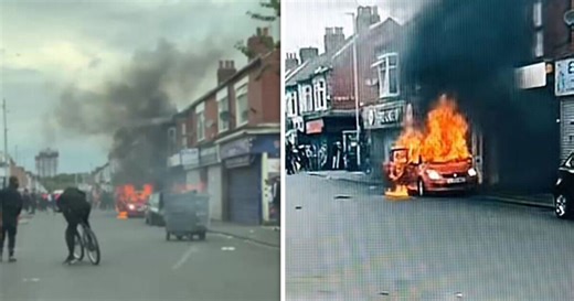 Car set on fire as rioters throw bricks at police