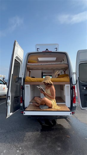 This Mercedes Sprinter has plenty of room to stand in, with a large, comfortable kitchen area including a 2 burner stove, sink, fridge freezer, and loads of storage drawers Enjoy your meal or work from home on your pull out dining table inside your camper, or rest drinks and snacks on your fold down table out the side door Rest in one of your comfy bunk beds, and star gaze through the extra large skylight Enjoy your hot water outdoor shower 🙌🏽 This camper was built for a local mum and her son 