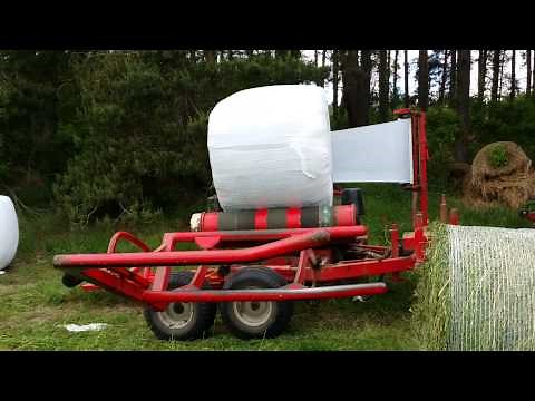 Wrapping bales with ELHO wrapper and Volvo BM 650 tractor