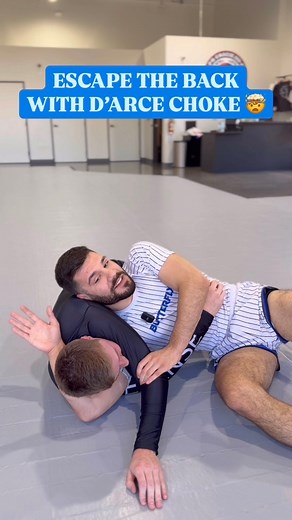 7.3K views · 89 reactions | Here’s one of the best examples of going from a defensive position straight into an offense position. If you’re able to free your legs and get their arm across your head, the d’arce is a great option when escaping back control 勞 #bjj #jiujitsu #grappling #submission #wrestling #judo #choke #gi #nogi #champion #fitness #gym | Christos Papadelos | Facebook