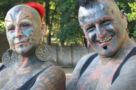 This married couple had a total of 98 body modifications