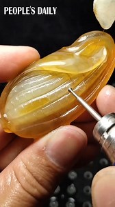 1.5M views · 11K reactions | An exquisite “corn” is born under the deft hands of a talented Chinese jade carving craftsman! | People's Daily, China | Facebook