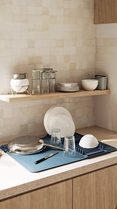 The UDry Peg by Umbra is a versatile drying solution with 8 customizable pegs for efficiently drying awkwardly shaped dishes. Combining a super-absorbent microfiber mat and a dish rack, it dries dishes quickly while keeping your counter clutter-free. Compact and foldable, it’s perfect for organizing and air-drying dishes, glasses, cutlery, and more. Shop the collection at modernquests.com (link in bio) #modernquests #umbradesign #kitchenware #kitchenessentials #dishdryingrack #dishrack #dishmat 