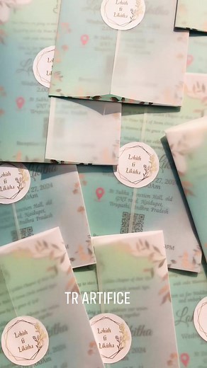 Wedding invitation card with transparent envelop and name logo....