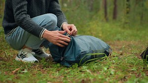 Camper Squatting On Forest Ground Unzipping Stock Footage SBV-352244686 - Storyblocks