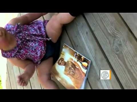 The Early Show - Baby plays with iPad, is frustrated by paper mag