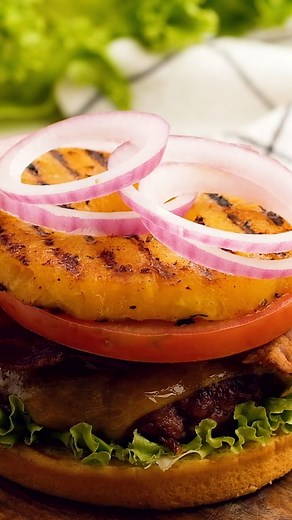 1.7K views | HAWAIIAN BURGERS!  They’re big, beefy, and topped with bacon, cheese, and grilled pineapple. They’re sweet, tangy, salty, and have the best flavors in every bite! TAP recipe link in bio @reluctantentertainer https://reluctantentertainer.com/hawaiian-burgers/ #hawaiinburger #pineappleburger #reluctantentertainer #burger #burgersofinstagram #burgerrecipes | Reluctant Entertainer | Facebook